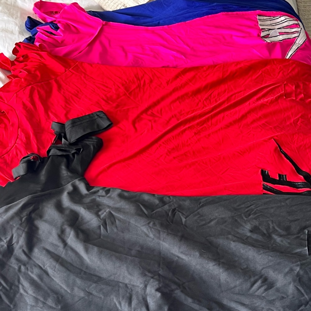 Nike, dress thigh length, with rips in sleeves and one thigh